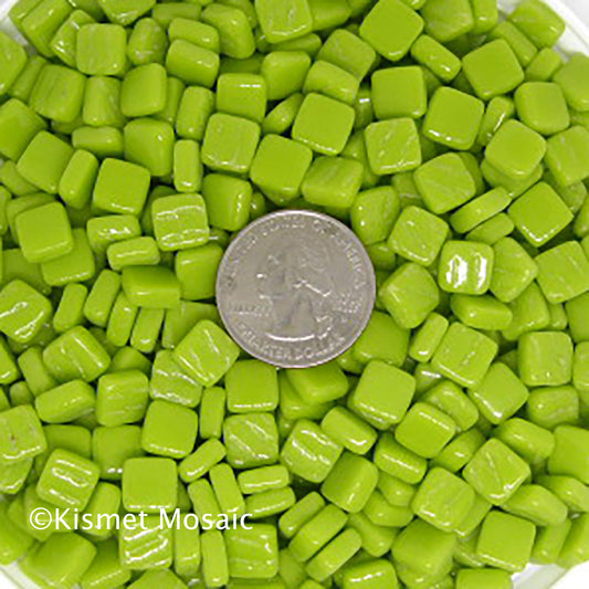 8mm vibrant Lime green mosaic tiles with a quarter for scale, showcasing glossy finish, ideal for artistic projects and DIY applications.