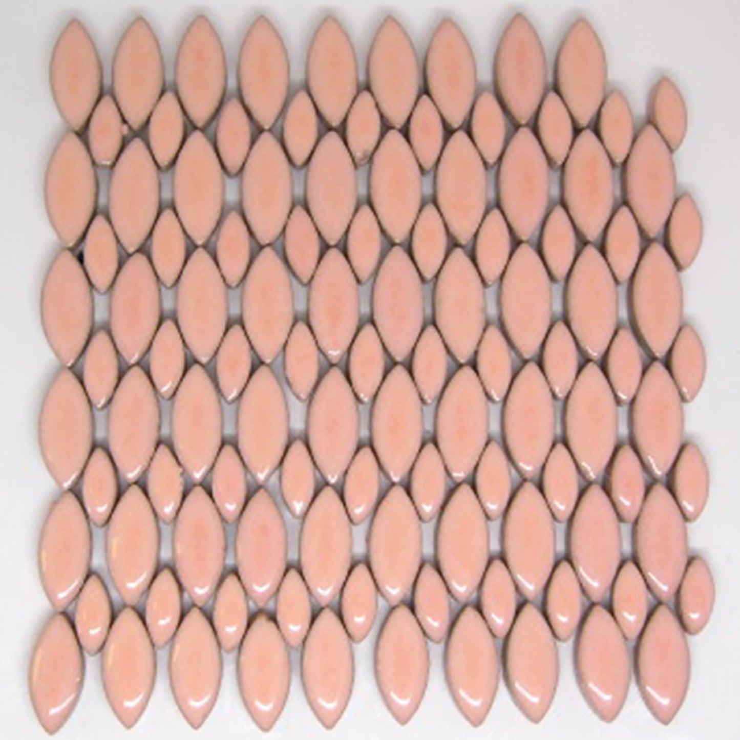 Glazed ceramic mosaic tiles in blush color arranged in a decorative pattern. The tiles feature an elongated petal or leaf shape in two sizes - larger and smaller ellipses. The blush glaze has a soft peachy-pink tone with a glossy, reflective finish. The pattern shows an average number tile in the 4 oz package.