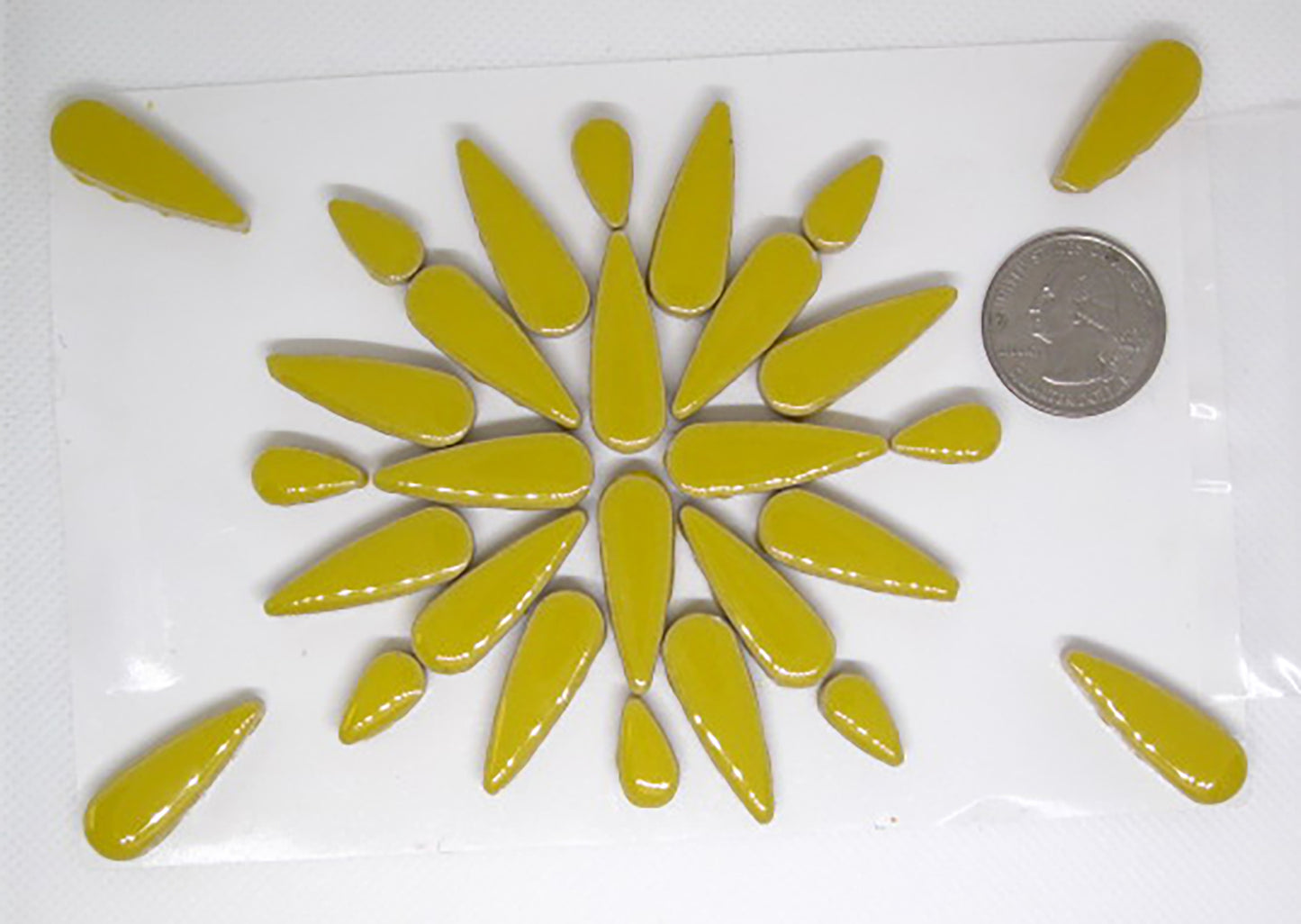 2 oz Yellow ceramic teardrops with a quarter for scale