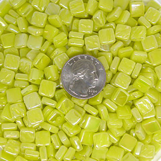 Vibrant yellow mosaic tiles from Kismet Mosaic's, showcasing iridized, square glass tiles ideal for your mosaic projects.