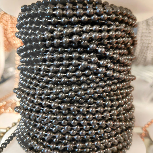 Black ball chain on spool