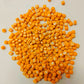 A close-up image of square tangerine orange micro mosaic tiles with a glossy finish.