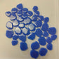 A collection of blue periwinkle glossy mosaic tiles with a petal shape.