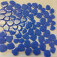 A collection of blue periwinkle glossy mosaic tiles with a petal shape.